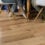 Lifestyle image of hardwood flooring with people seated on chairs.